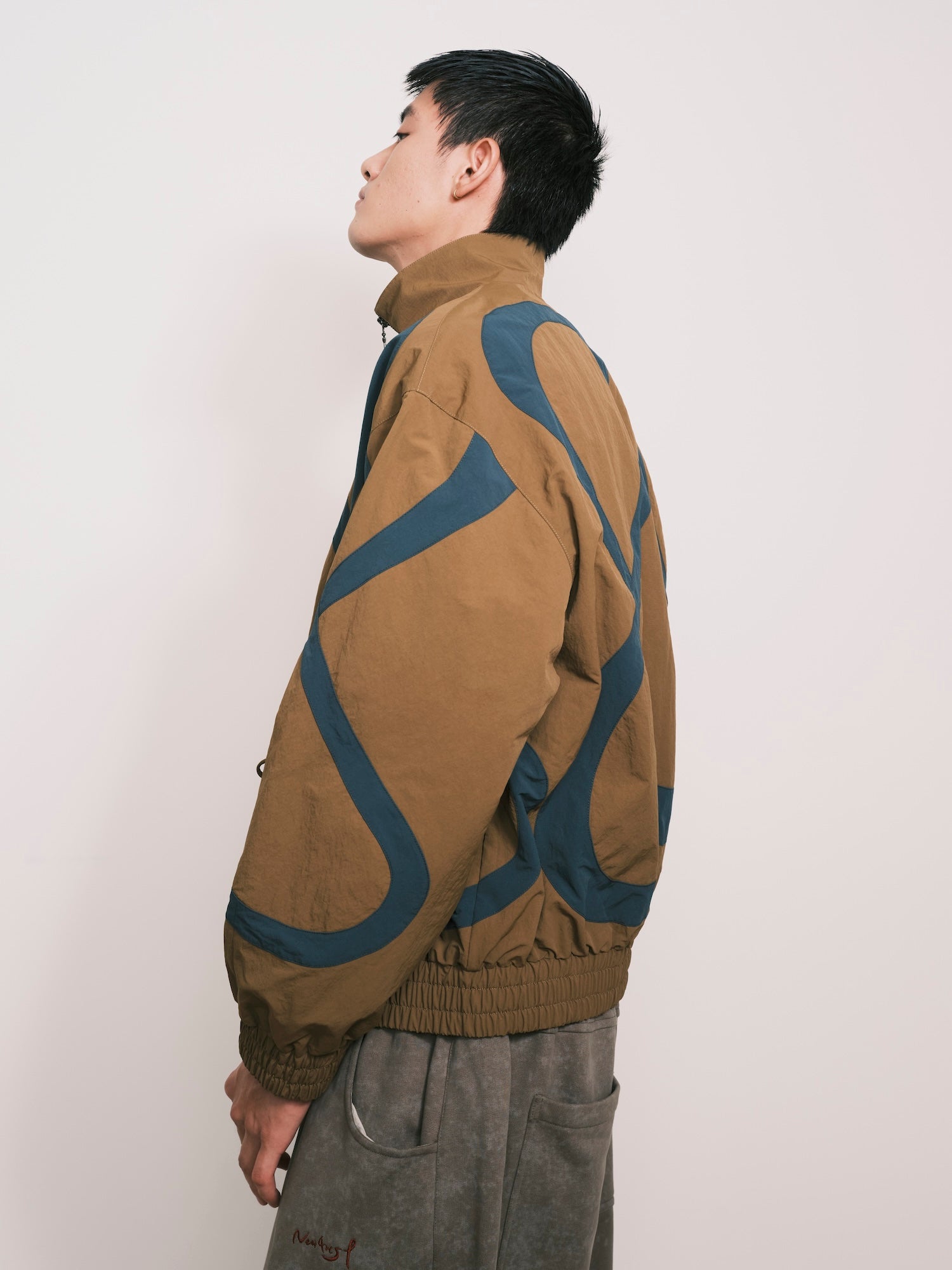 “Umoja” Cut-Out Pocket Nylon Jacket