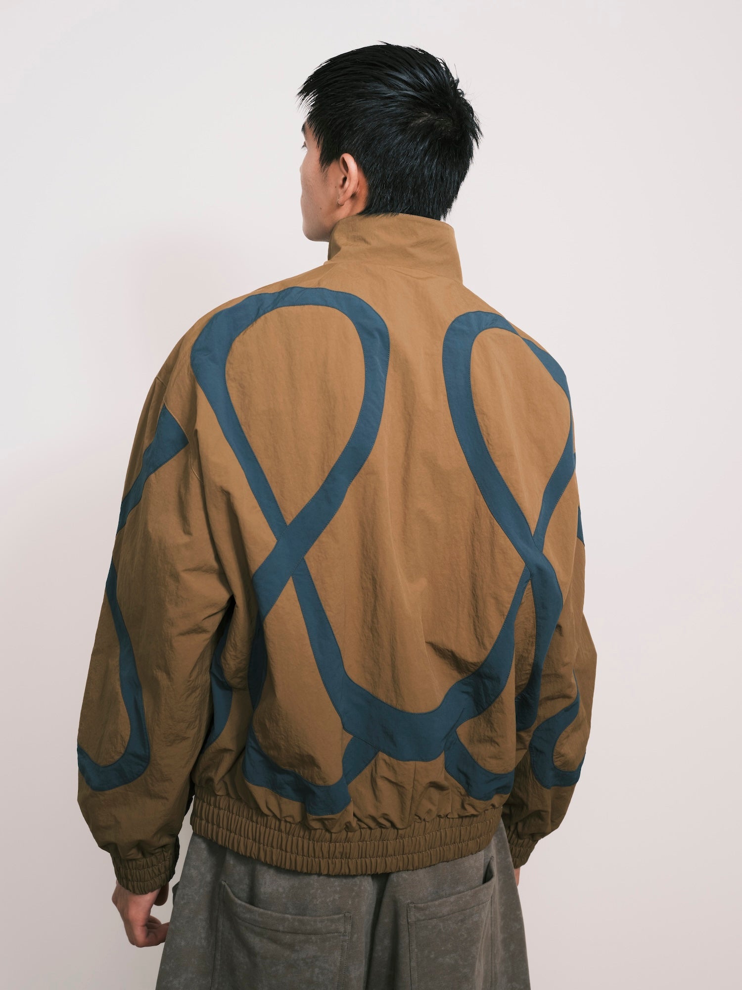 “Umoja” Cut-Out Pocket Nylon Jacket