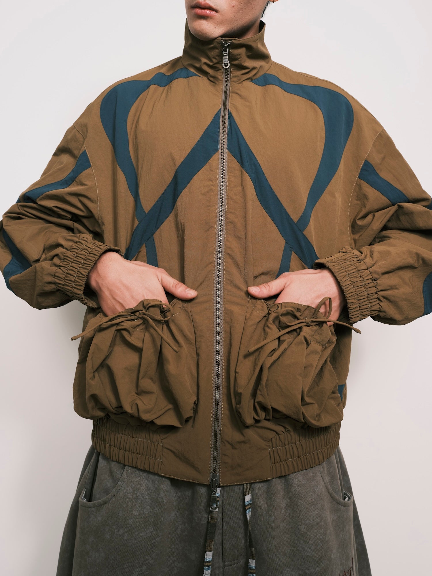 “Umoja” Cut-Out Pocket Nylon Jacket
